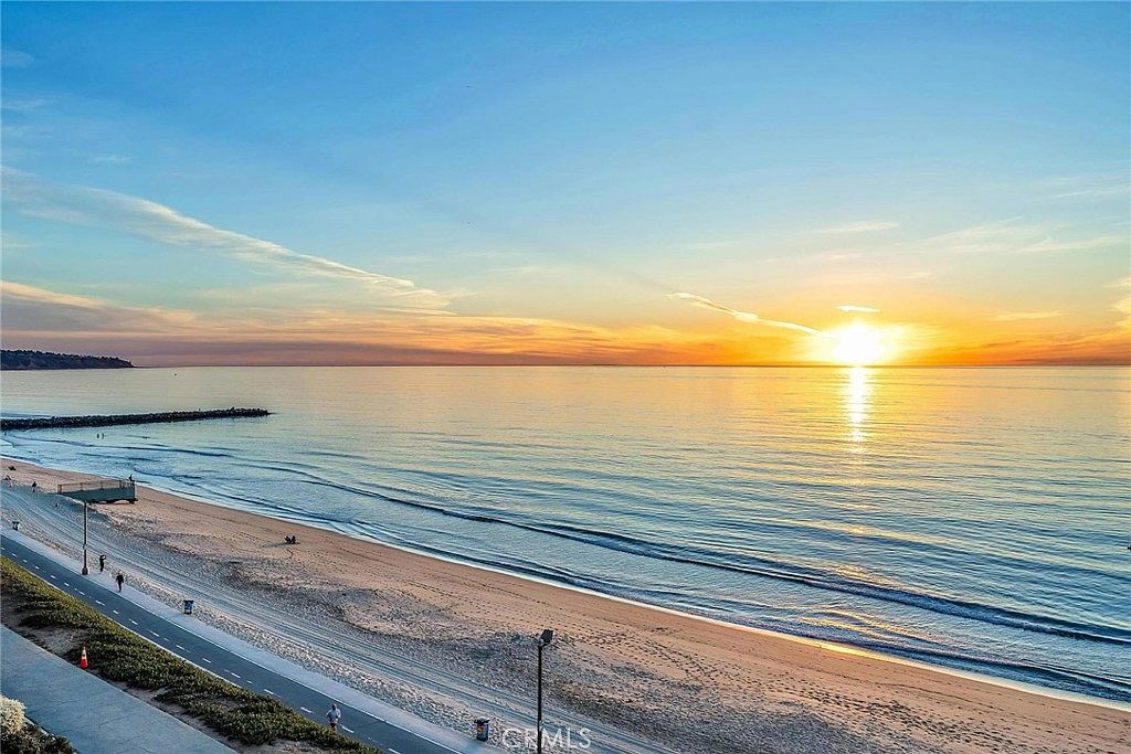 Ocean-view penthouse at 200 S Catalina Ave, Redondo Beach, with floor-to-ceiling glass overlooking the Pacific